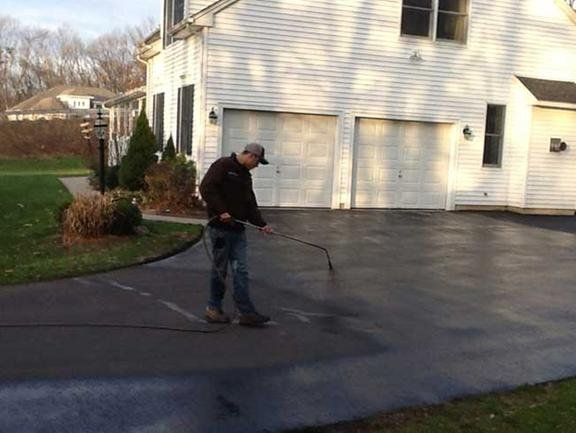Compacting Asphalt At Road Repair Workers On Asphalting Road — Glastonbury, CT — American USA Paving