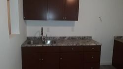 There is a sink in the middle of the kitchen.