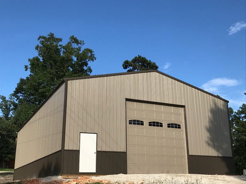A large metal building with a large garage door