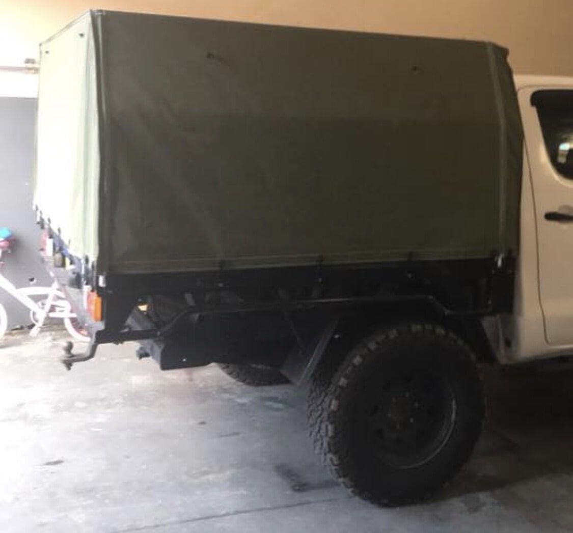 A White Truck with A Canopy Is Parked in A Garage - Quality Canvas Products In Illawarra, NSW