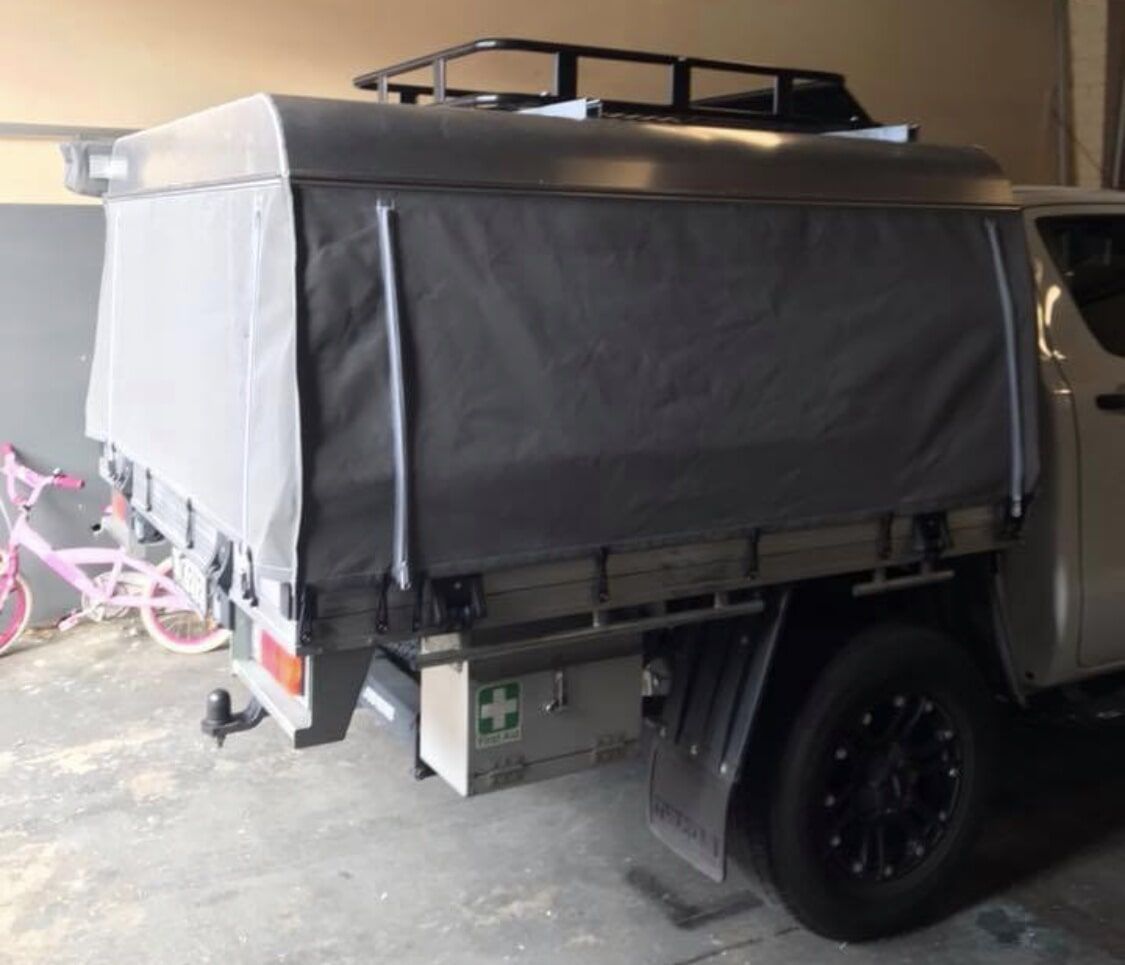 A Truck with A Canopy on Top of It Is Parked in A Garage - Quality Canvas Products In Illawarra, NSW