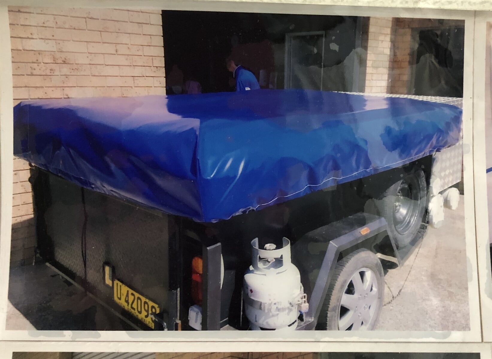A Picture of A Trailer with A Blue Tarp on It - Quality Canvas Products In Illawarra, NSW