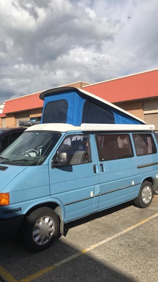 A Blue Van with A Pop-up Roof Is Parked in A Parking Lot - Quality Canvas Products In Illawarra, NSW