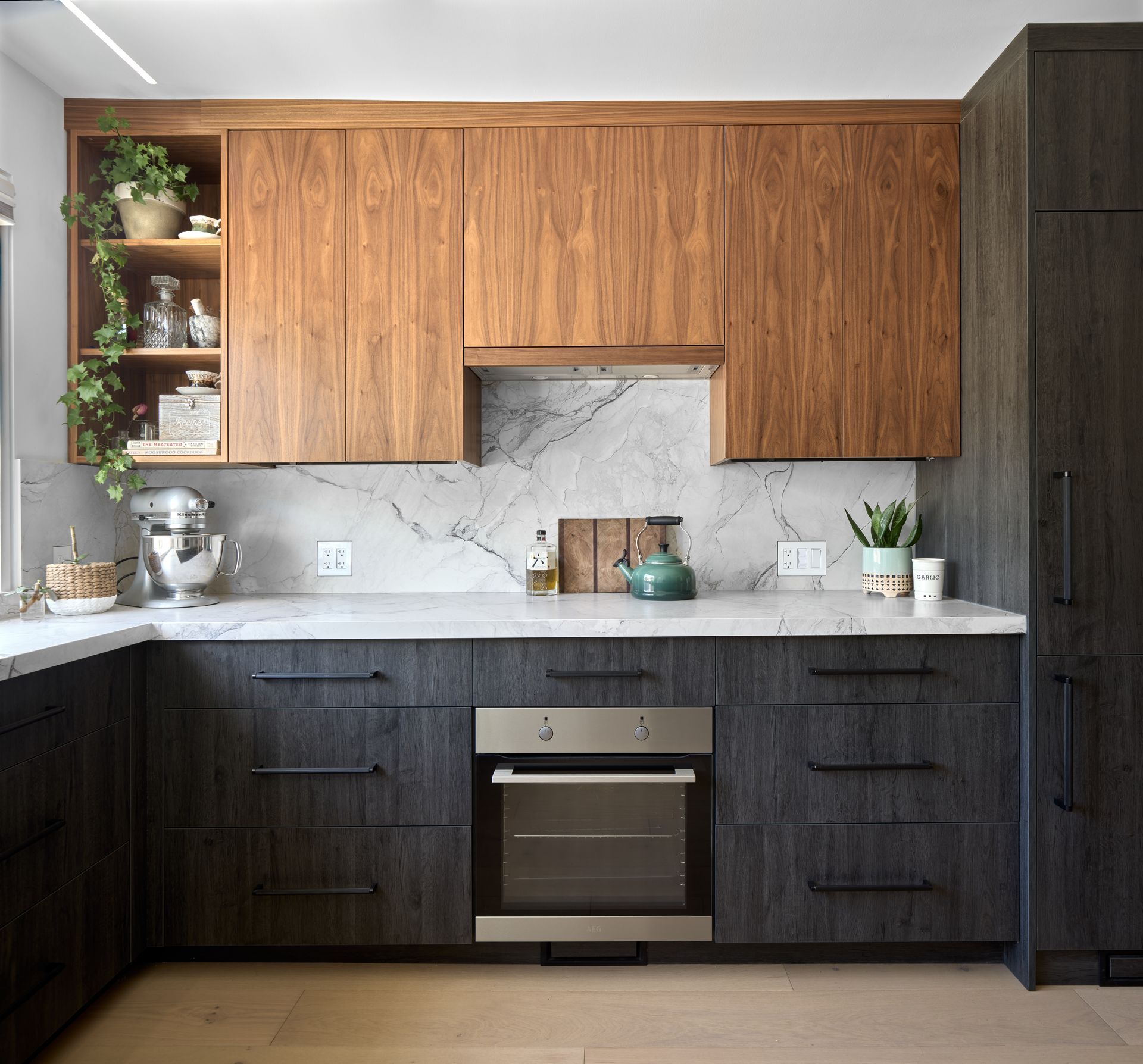 A kitchen with wooden cabinets and stainless steel appliances