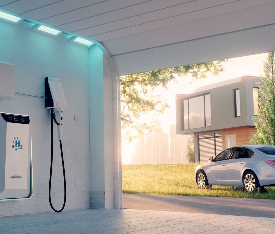 An electric car is being charged at a charging station.