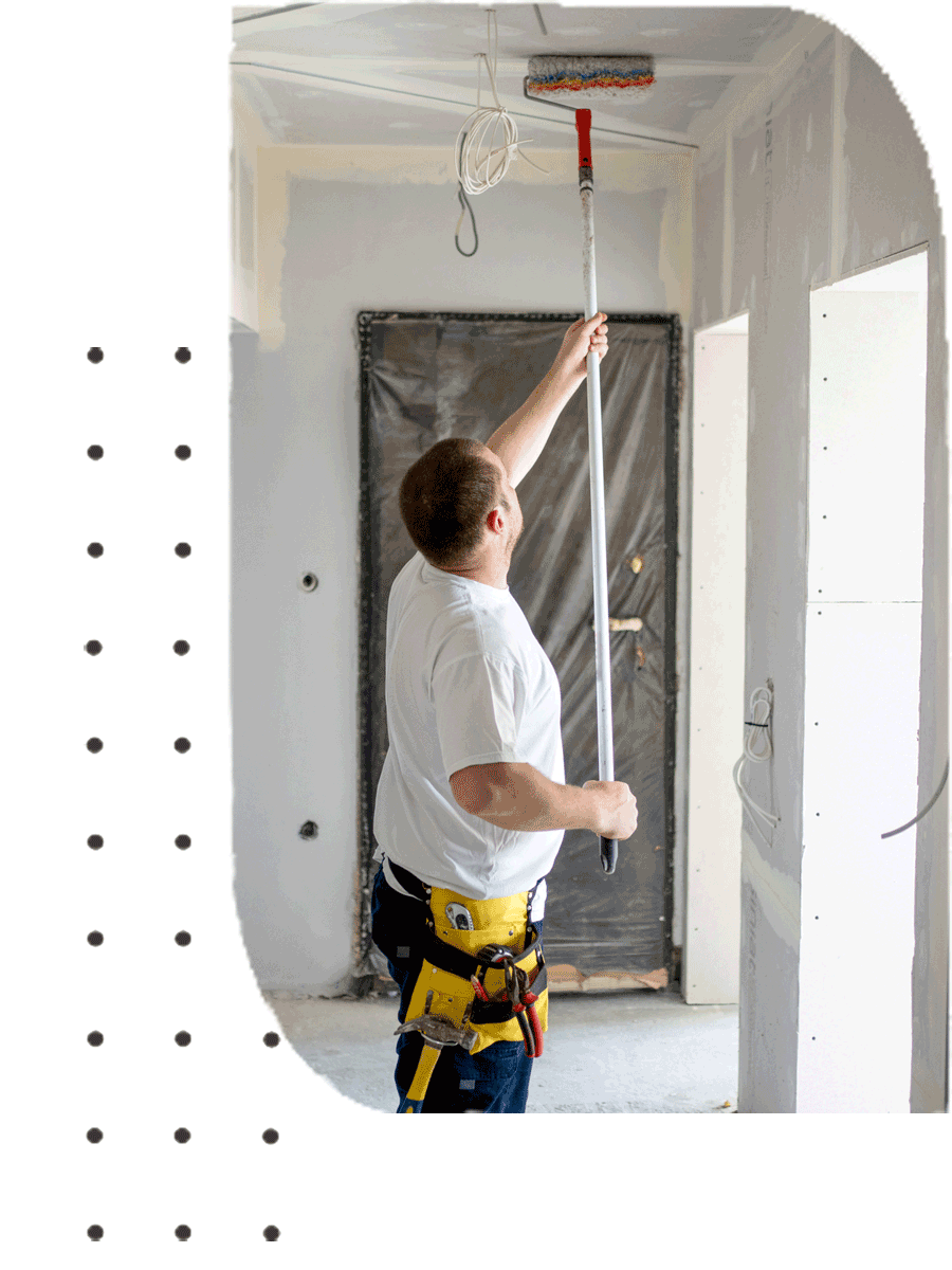 A man painting a ceiling | Sydney, NSW | Polypaint A man painting a ceiling | Sydney, NSW | Polypaint