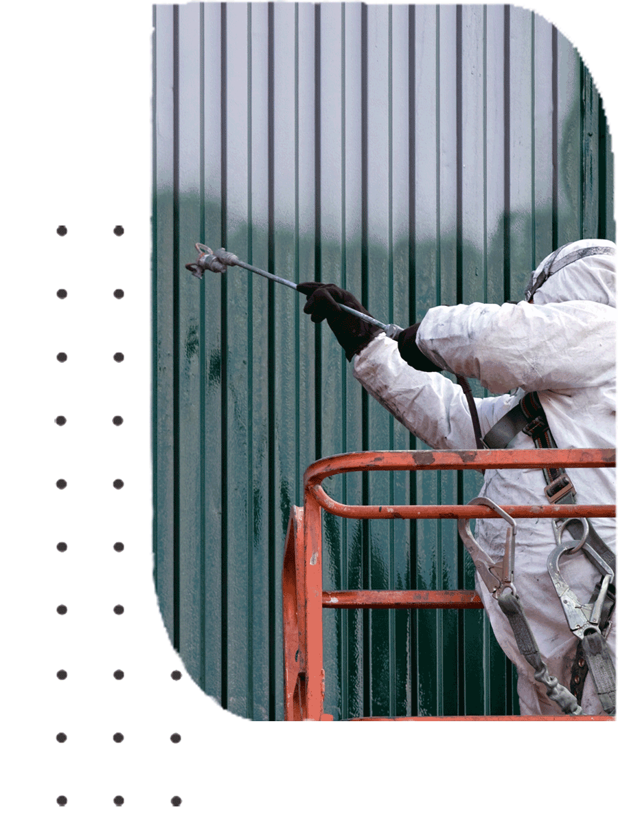 A person spraying a wall with green colour paint | Sydney, NSW | Polypaint A person spraying a wall with green colour paint | Sydney, NSW | Polypaint