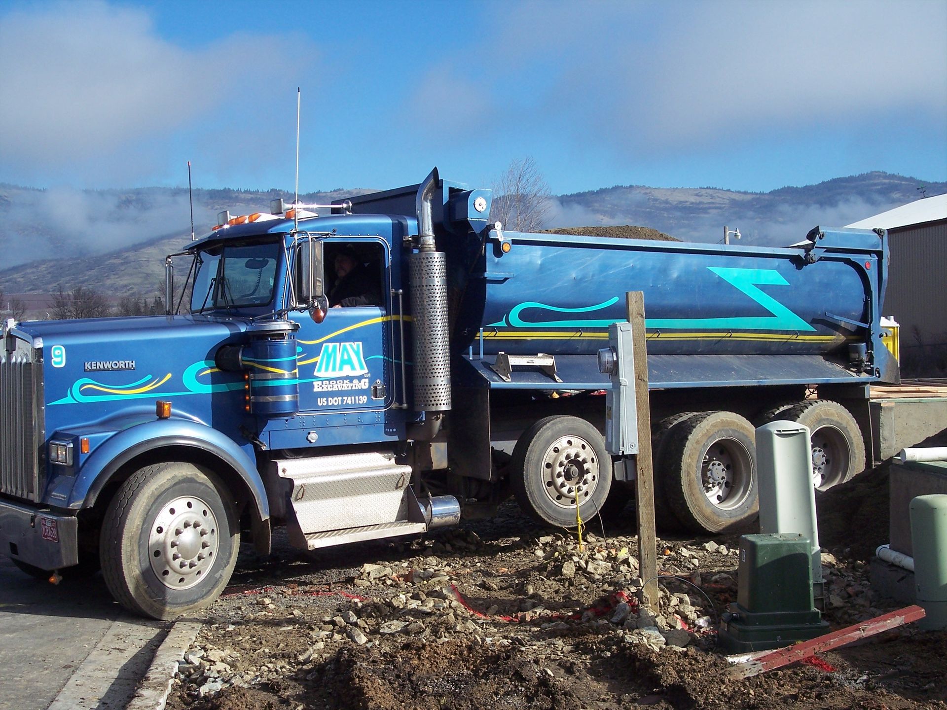 Blue 10 yard dump truck in Talent, Oregon.