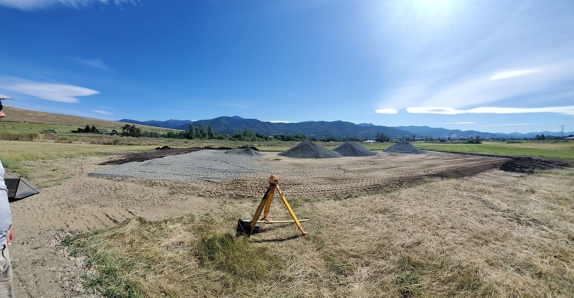 Loads of gravel on a building pad construction site.