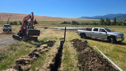 A water line is being trenched for a new home site in Ashland, Oregon