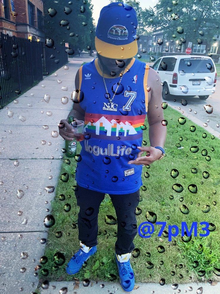 A Man Wearing #MogulLife Jersey