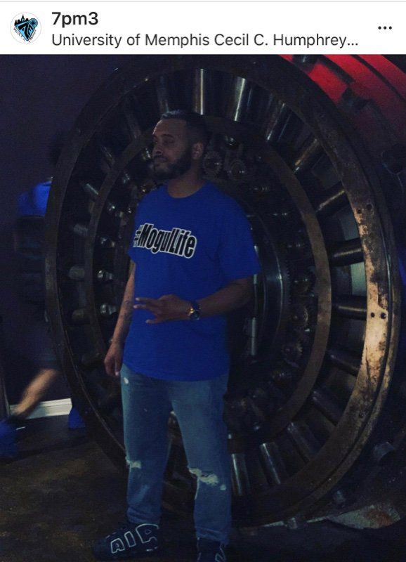 A Man Wearing #MogulLife T-Shirt