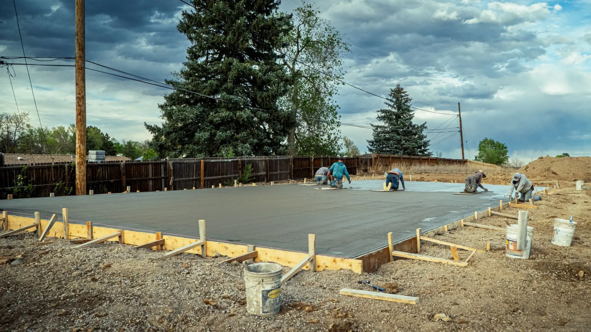 Freshly poured monolithic concrete slab foundation with formed
edges on a residential site in Brighton CO