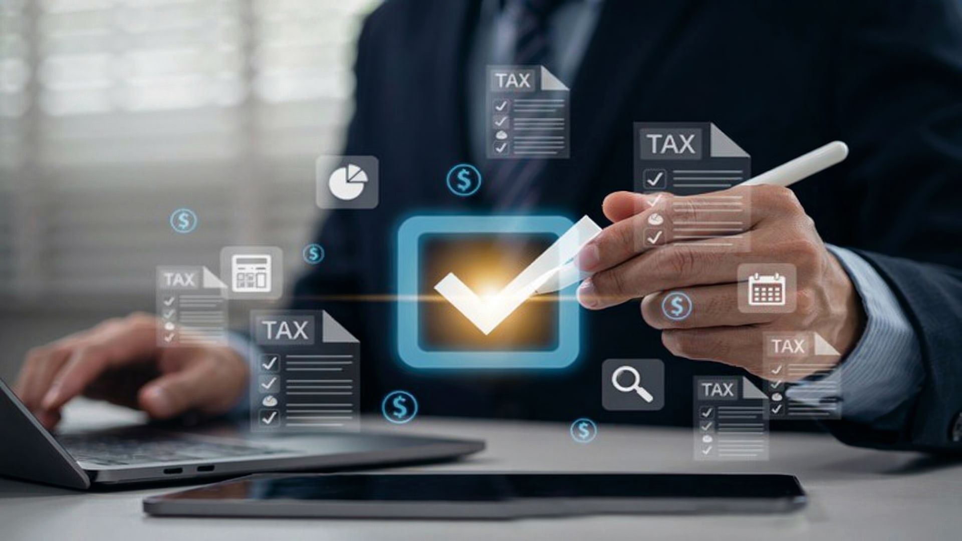 A tax consultant reviewing digital tax checklists on a laptop and tablet.