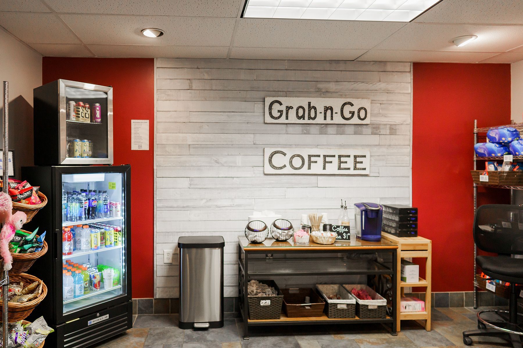 A room with a sign that says grab n go coffee