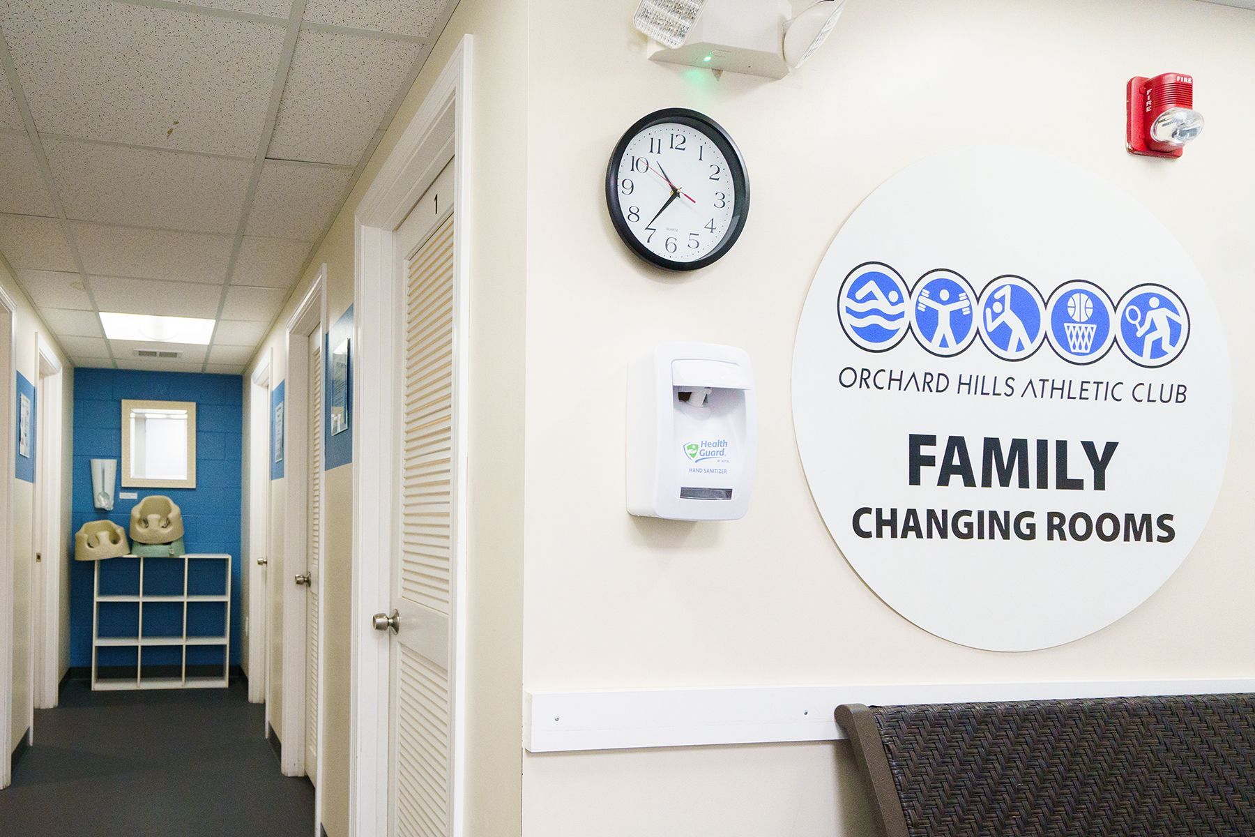 A hallway with a sign that says family changing rooms
