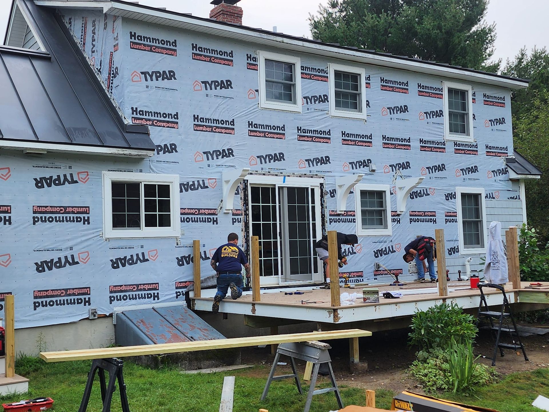 A house is being remodeled with styrofoam on the side.