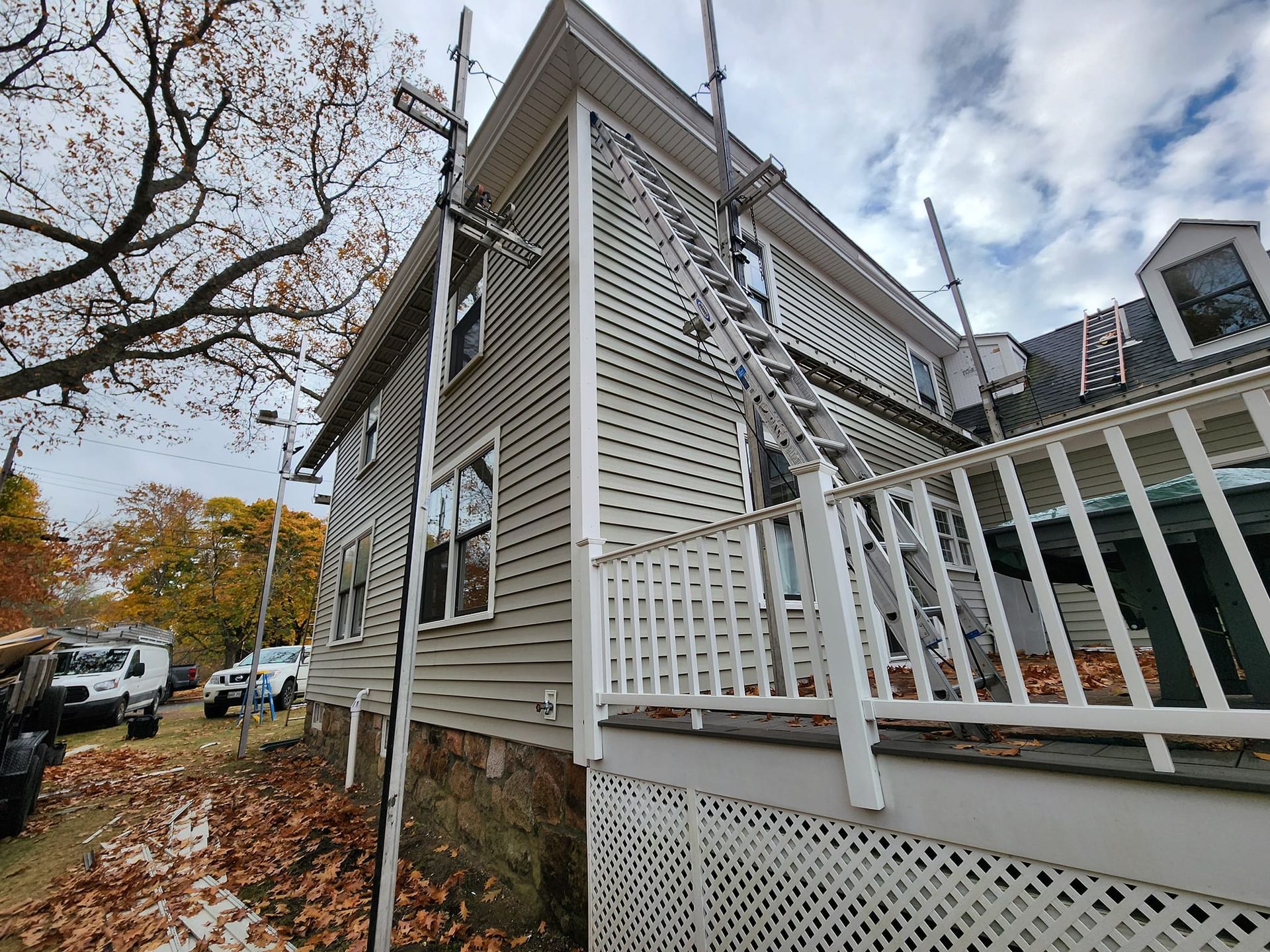 A house with a ladder on the side of it.