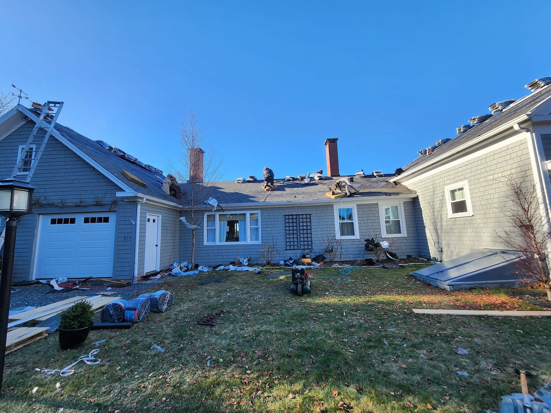 A house with a roof that is being remodeled.
