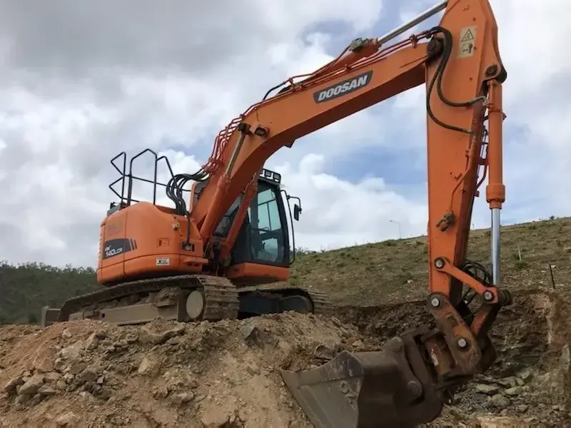Yellow Digger Loading Dirt — Riley Earthmoving in Deeragun, QLD