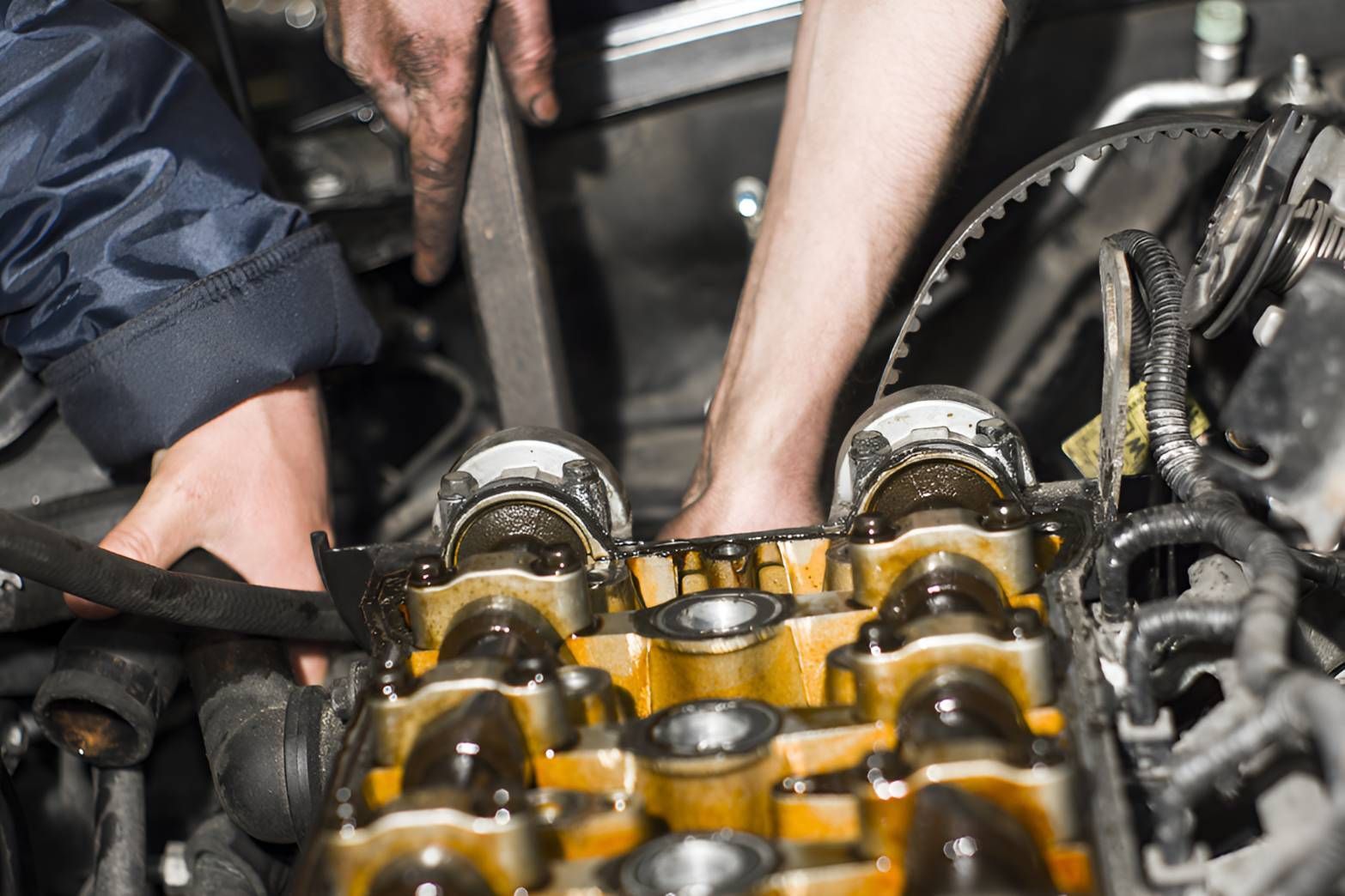 A Man Is Working On The Engine Of A Car — Brake & Clutch Automotive Services in Ciccone, NT