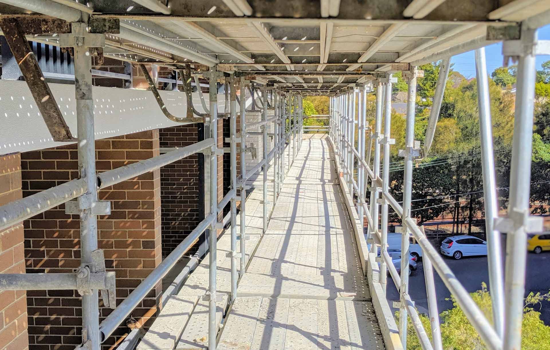 A Scaffolding Is Being Built On The Side Of A Building – Blacktown, NSW - Sydney Hoist & Scaffolding