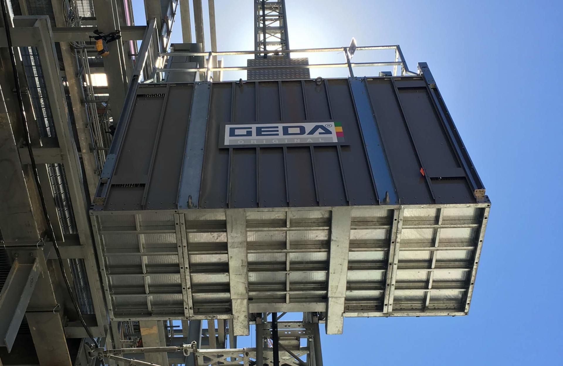 A Large Metal Box Is Hanging From The Side Of A Building – Blacktown, NSW - Sydney Hoist & Scaffolding