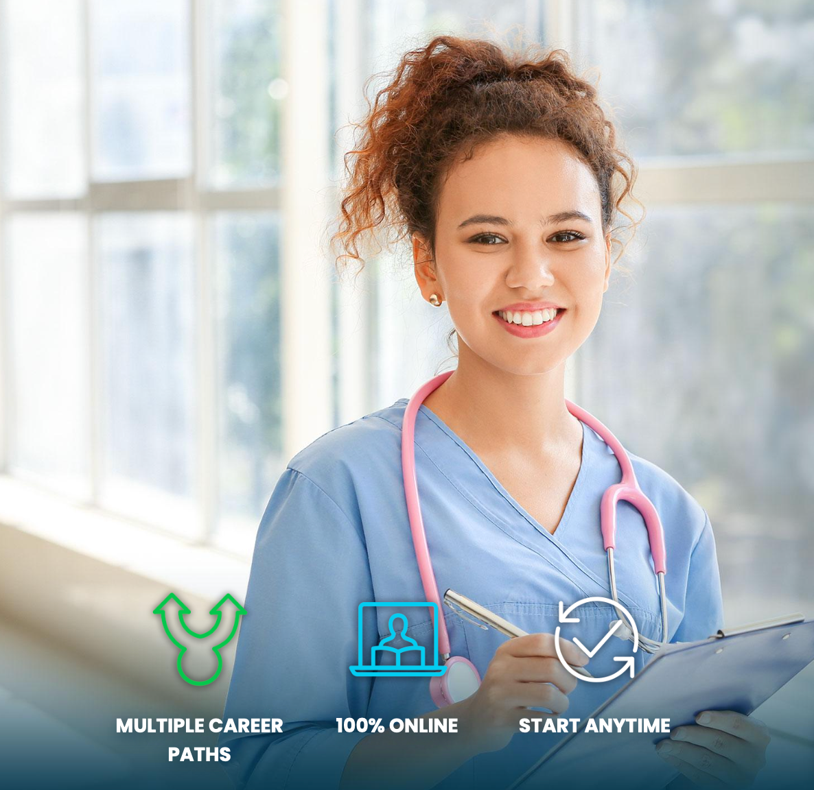A nurse with a stethoscope around her neck is smiling while holding a clipboard.