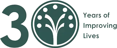 30 Years of Improving Lives logo with a green circular tree icon