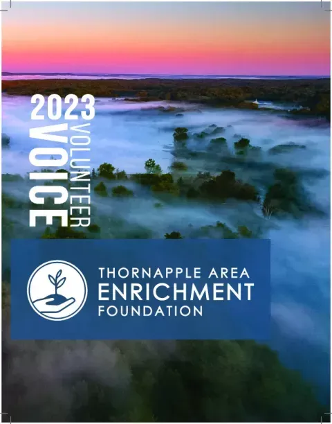 2023 Volunteer Voice cover for Thornapple Area Enrichment Foundation over a foggy sunrise landscape