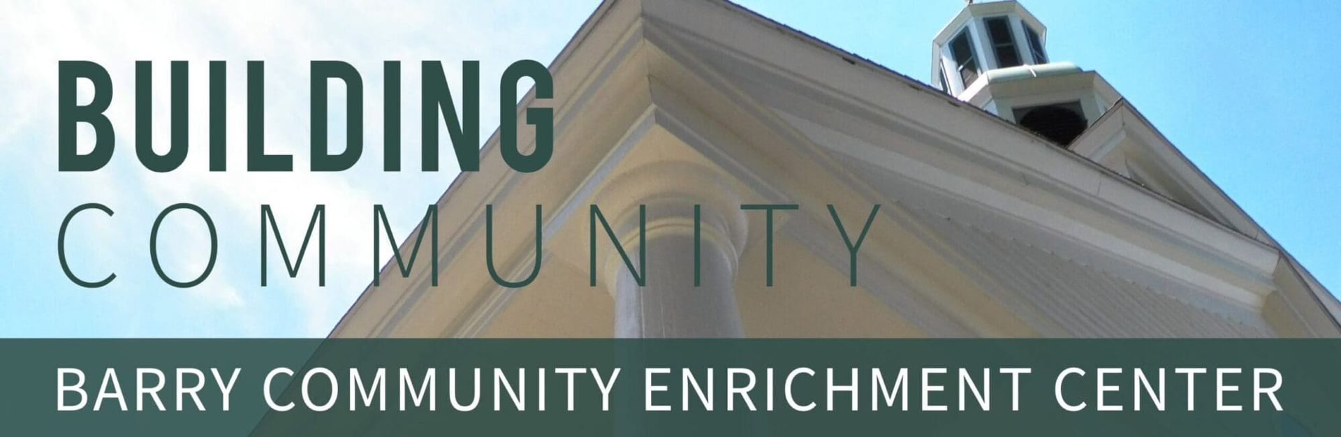 Building Community sign for Barry Community Enrichment Center on a modern building facade.
