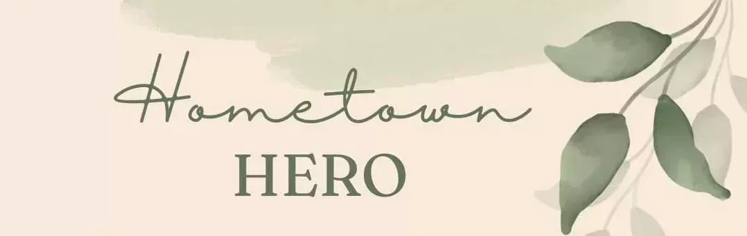 “Hometown Hero” text on a soft beige background with green leaves on the right