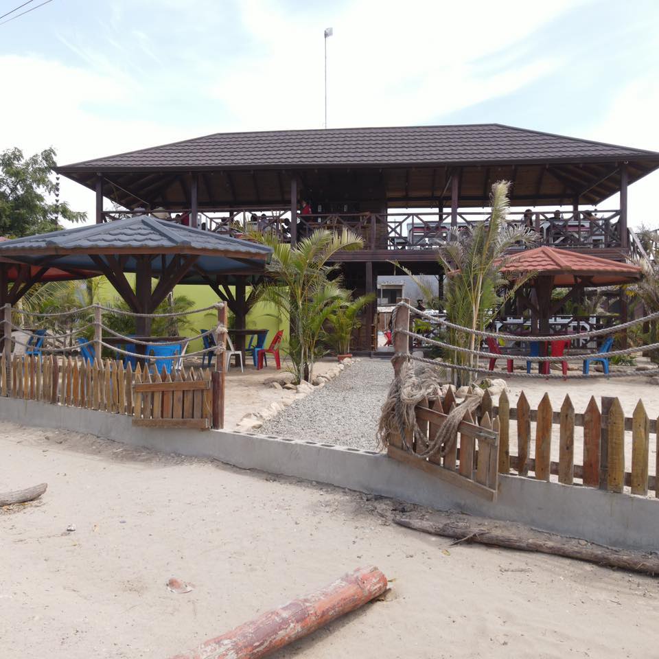A large house with a wooden fence around it
