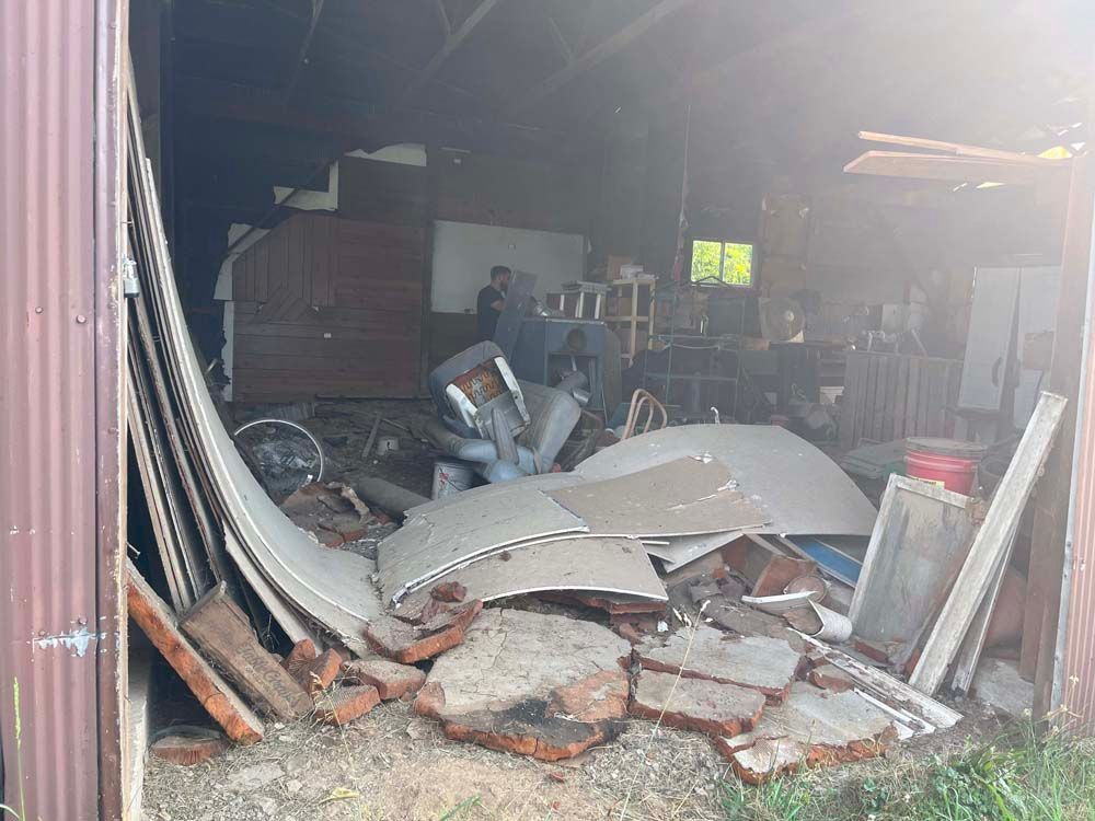 There is a lot of trash in the garage.