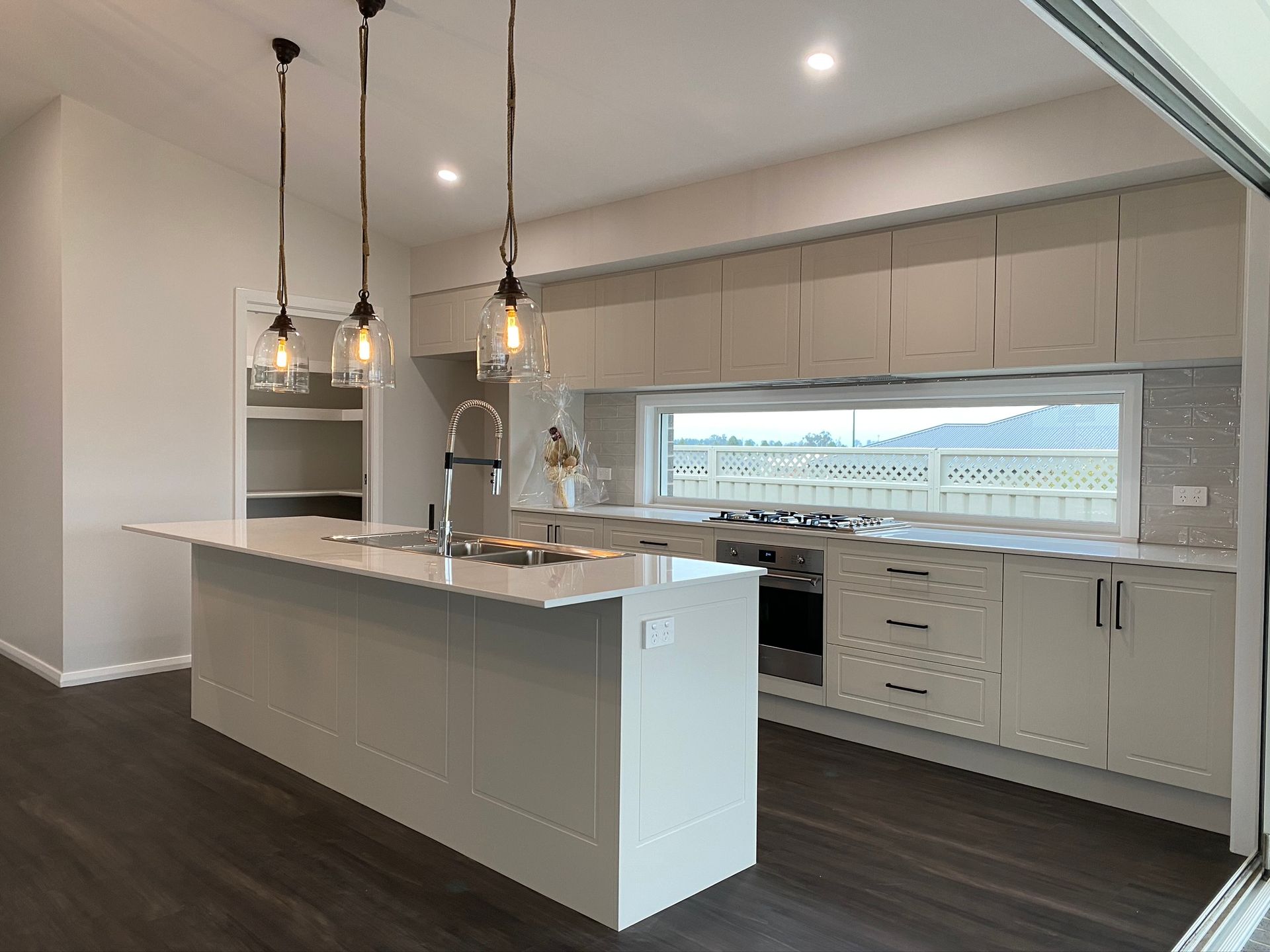 Modern Kitchen Interior With Large Window — Kitchen Renovations in Dubbo, QLD