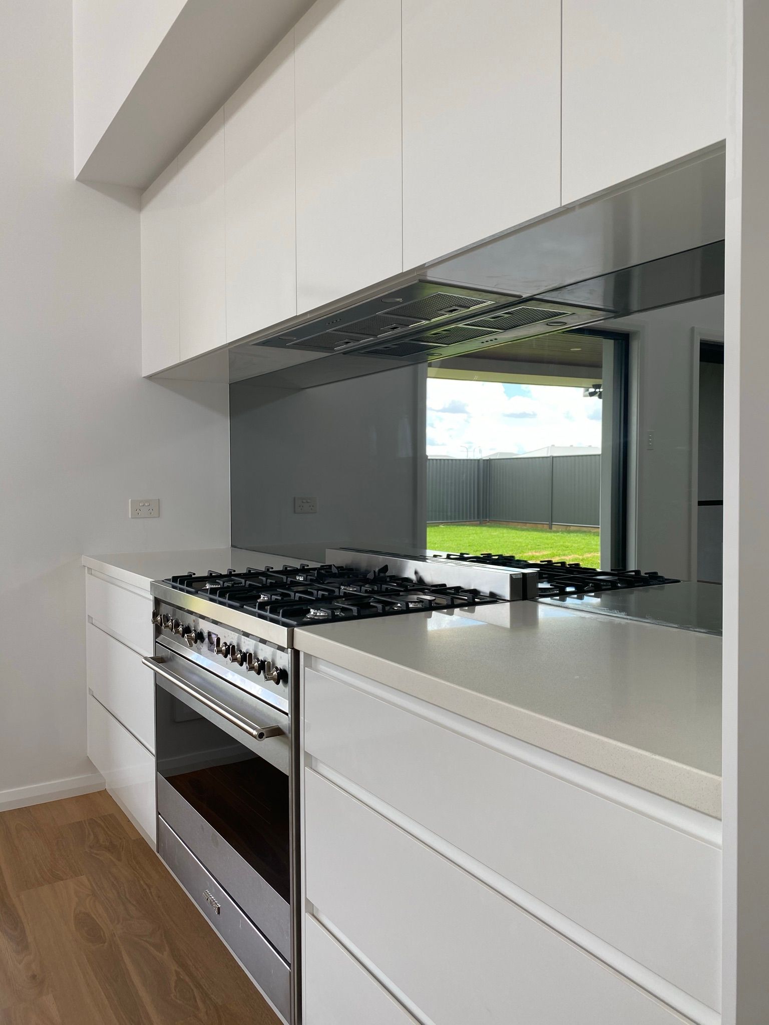 Kitchen Interior With Large Mirror — Kitchen Renovations in Dubbo, QLD