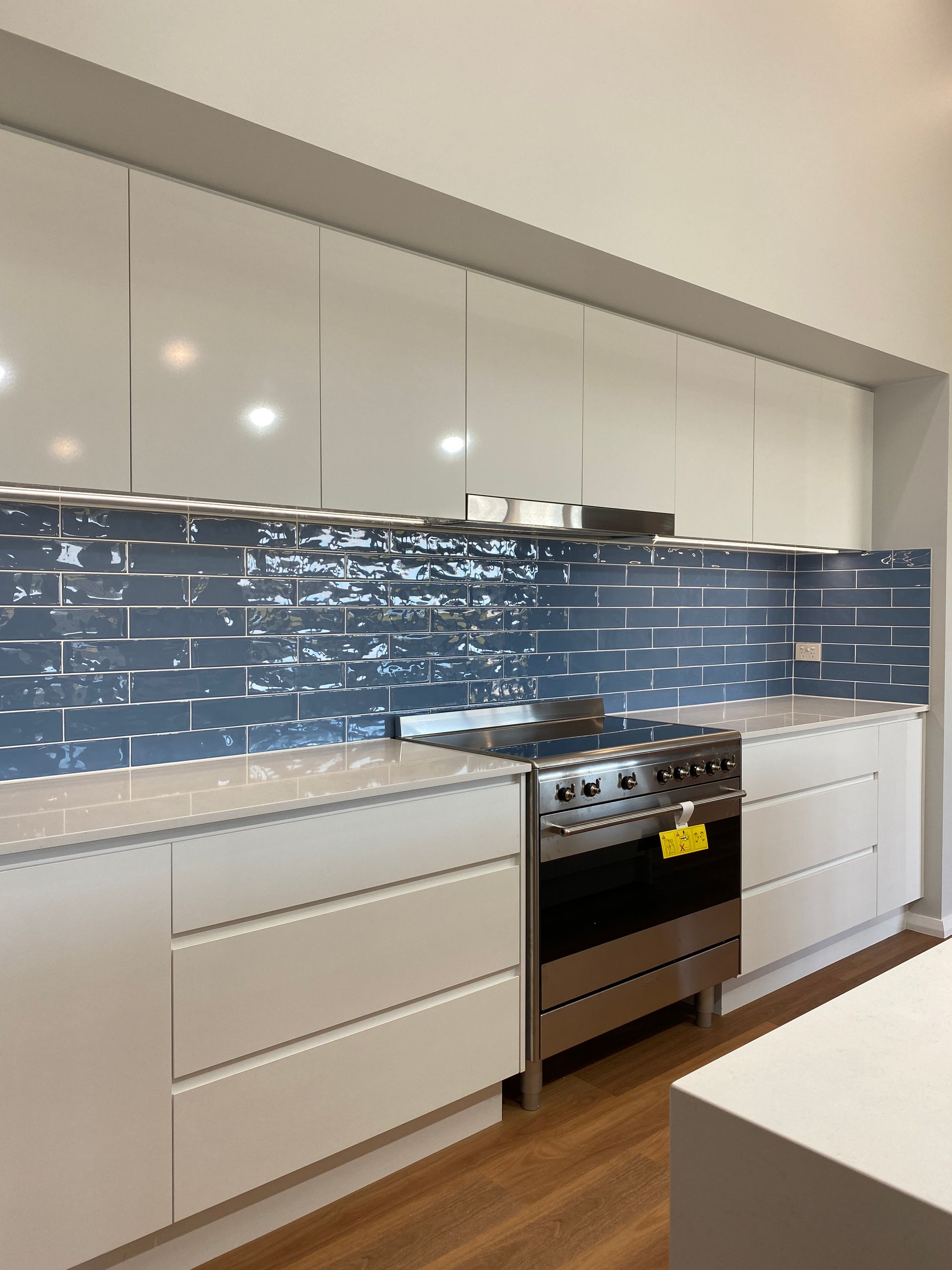 White Countertop With Stove — Kitchen Renovations in Dubbo, QLD