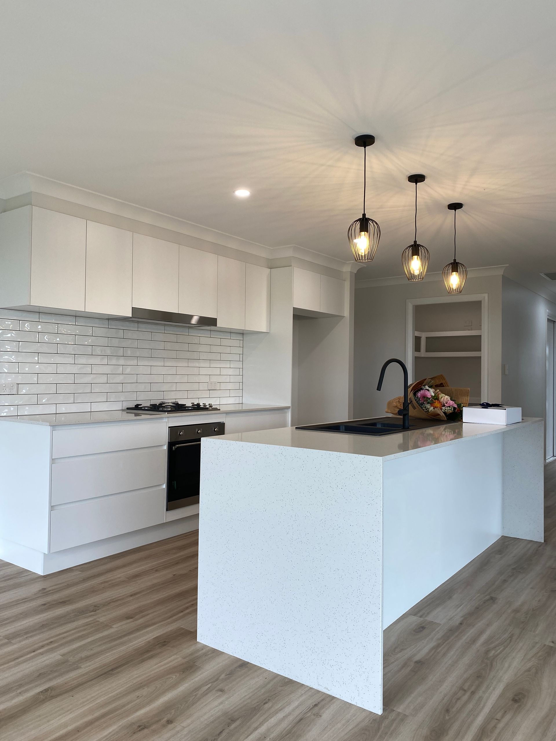 Beautiful Kitchen With Pendants Lights — Kitchen Renovations in Dubbo, QLD