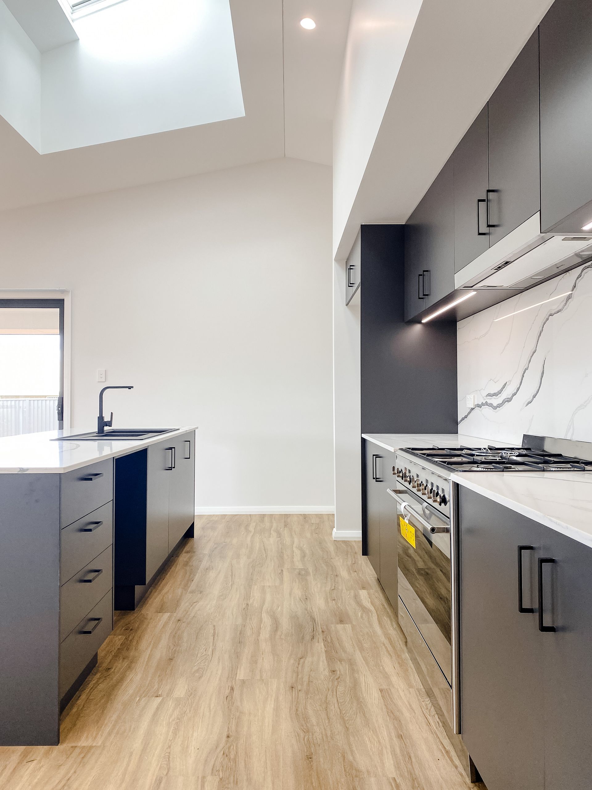 Kitchen in New Luxury Home With Marble Countertop — Kitchen Renovations in Dubbo, QLD