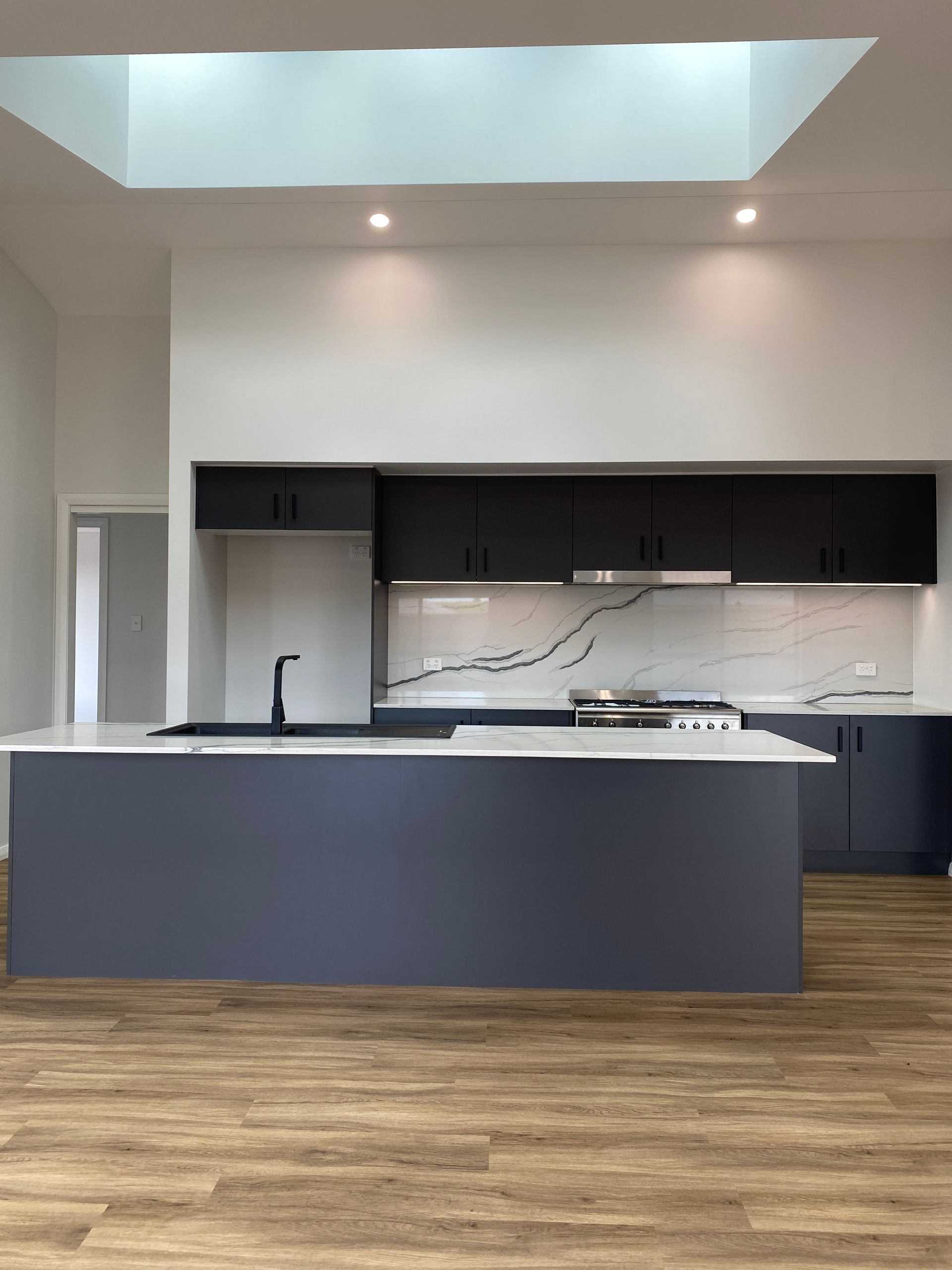 Front View of New Kitchen With White Countertop — Kitchen Renovations in Dubbo, QLD