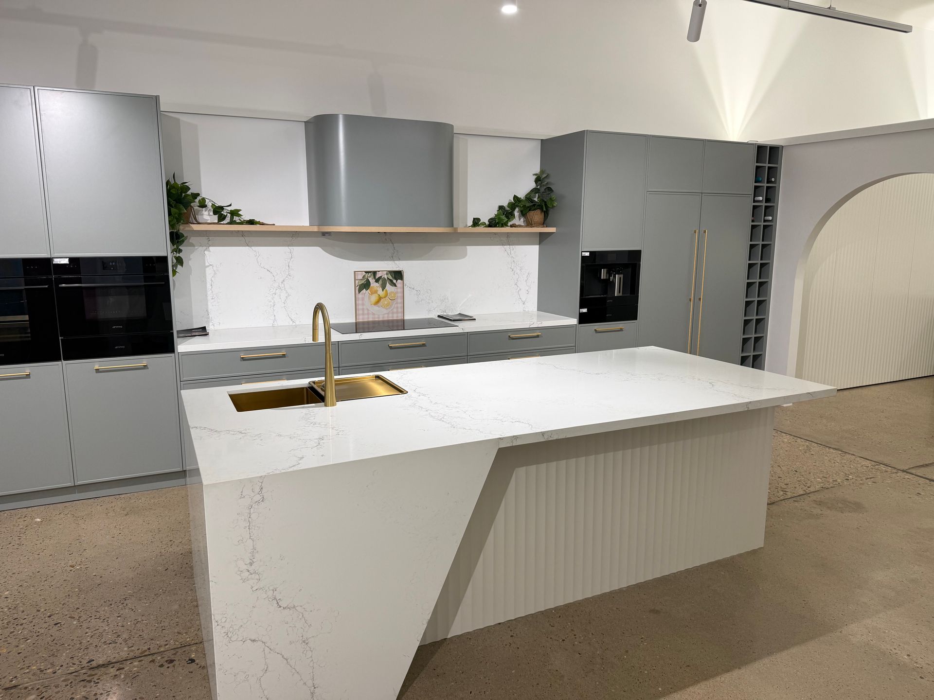 White Kitchen Cabinets And Wooden Floor — Kitchen Renovations in Dubbo, QLD
