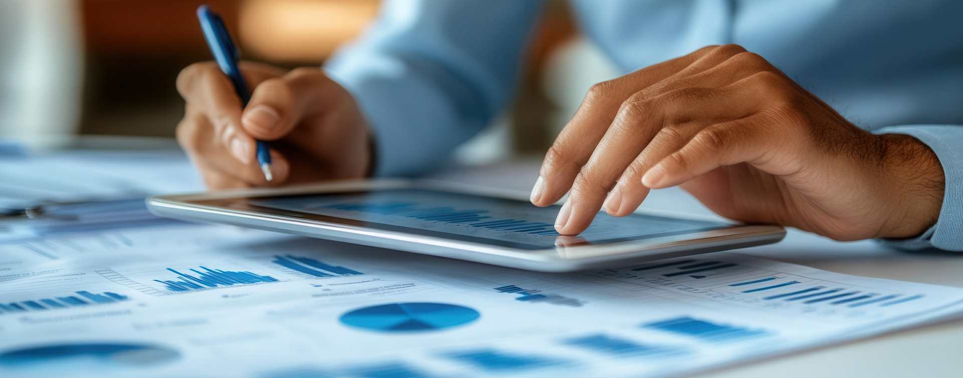 A person is using a tablet computer while holding a pen.