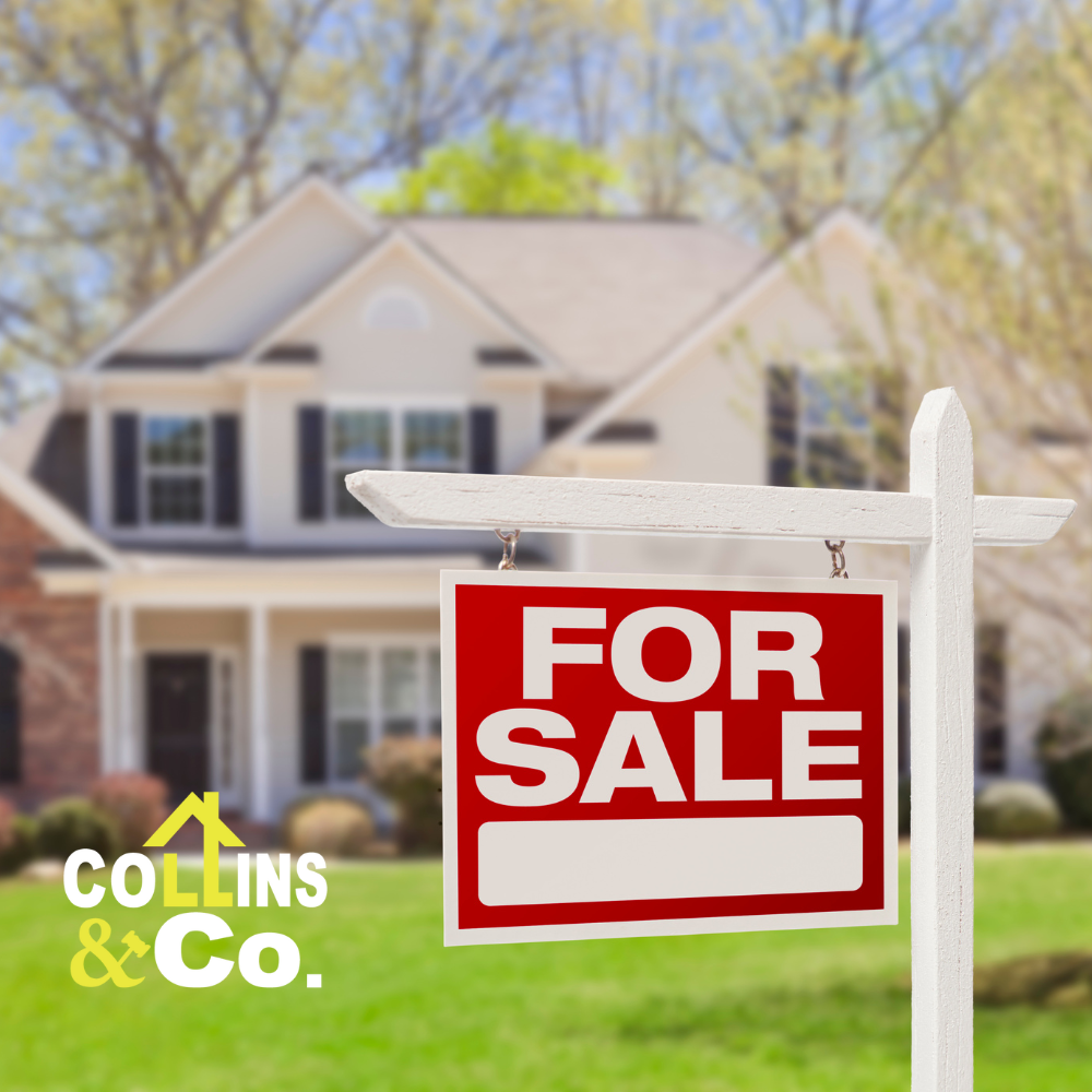 A for sale sign in front of a house