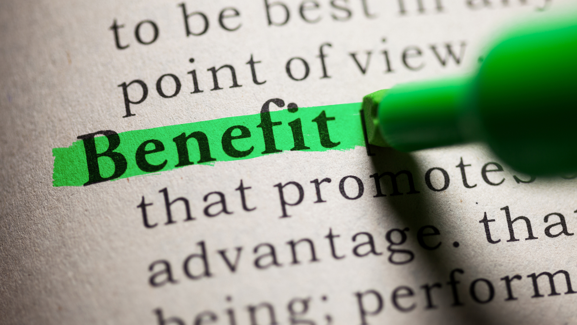 Green highlighter marking the word “Benefit” on printed text
