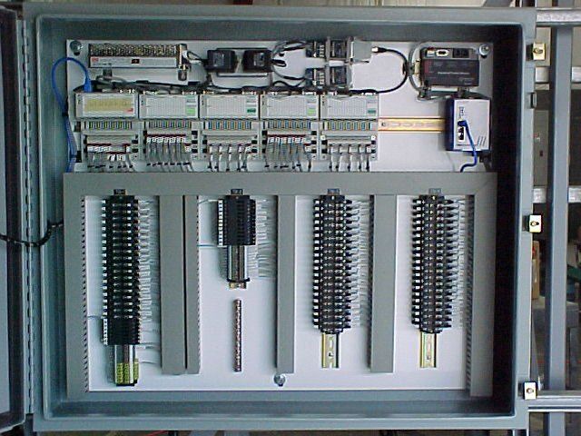 A large electrical box with a lot of wires coming out of it