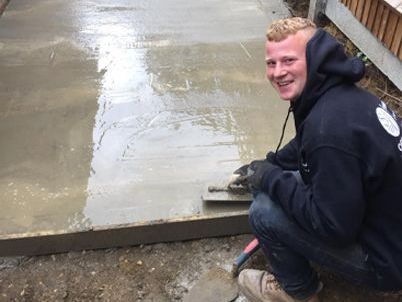 S&T team laying cement for a driveway project