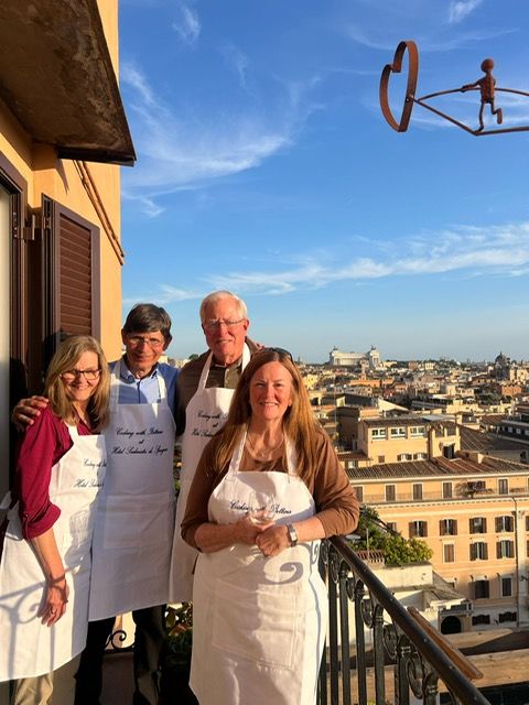 Guests and chef at the end of their cooking class for couples at Hotel Scalinata di Spagna in Rome