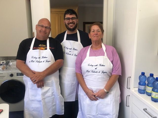 Guests and chef at the end of their cooking class for families at Hotel Scalinata di Spagna in Rome