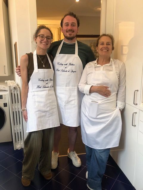 Guests and chef at the end of their cooking class for couples at Hotel Scalinata di Spagna in Rome