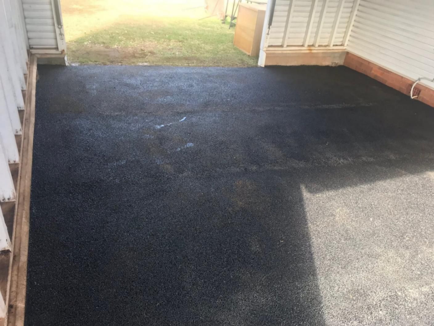 Black Asphalt Driveway with A White House in The Background — Potholes ‘R’ Us In Toowoomba, QLD